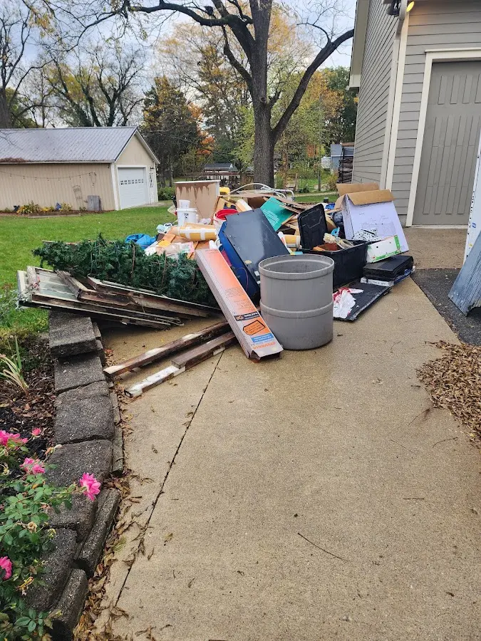 Dumpster being loaded with debris for 12 Yard Dumpster Rental in Healdsburg
